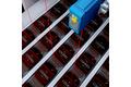 Detection of flat products on conveyor belts