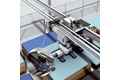 Linear positioning in electrical overhead conveyors