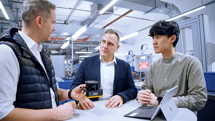 Automation partners working together as a team to utilize potential and ensure success. From left to right: Philipp Maurer, SICK, Steffen Kuhnle, Gessmann, and Qiun Fat Diu, Wilkinson Sword. 